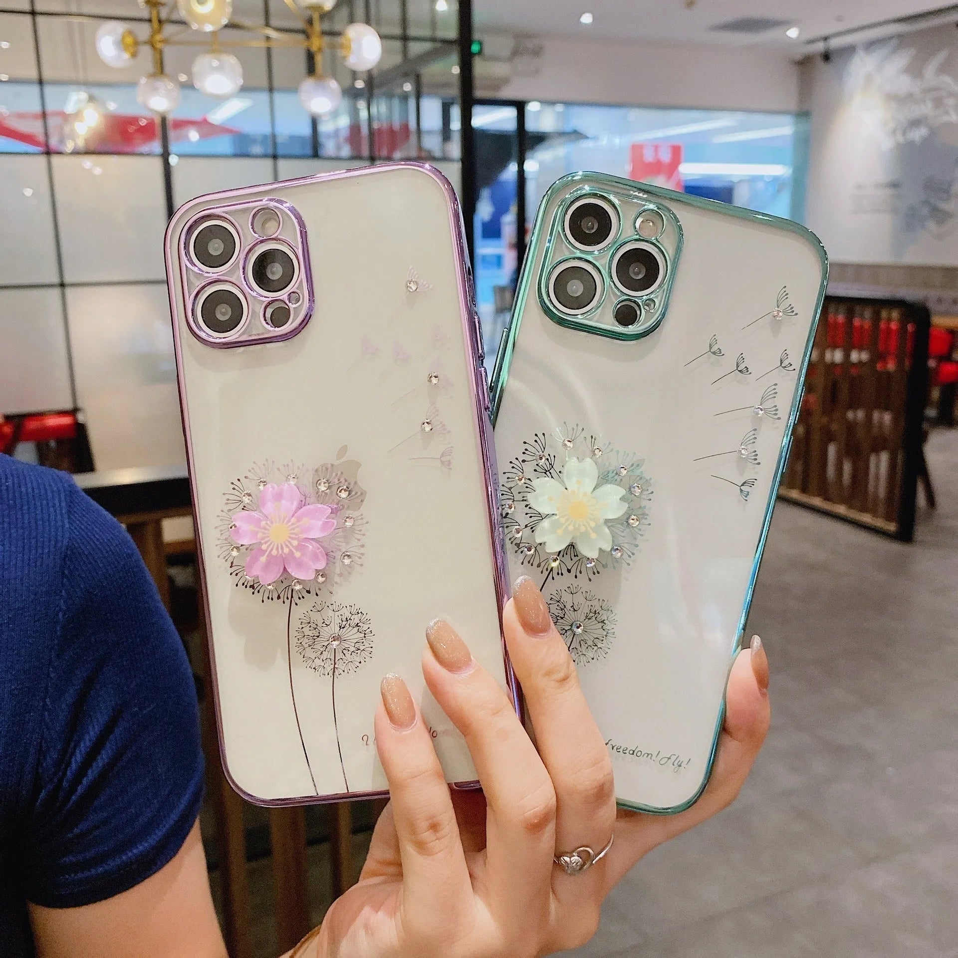 Green 3D floral design iPhone case with a rotating kickstand extended, showing the integrated screen protector.