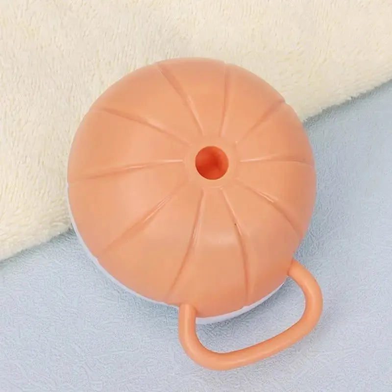 Orange silicone dog bath brush with shampoo dispenser and soft TPR bristles for pet grooming