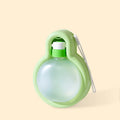 Green portable dog water bottle with pull-out drinking bowl, shown next to a dog.