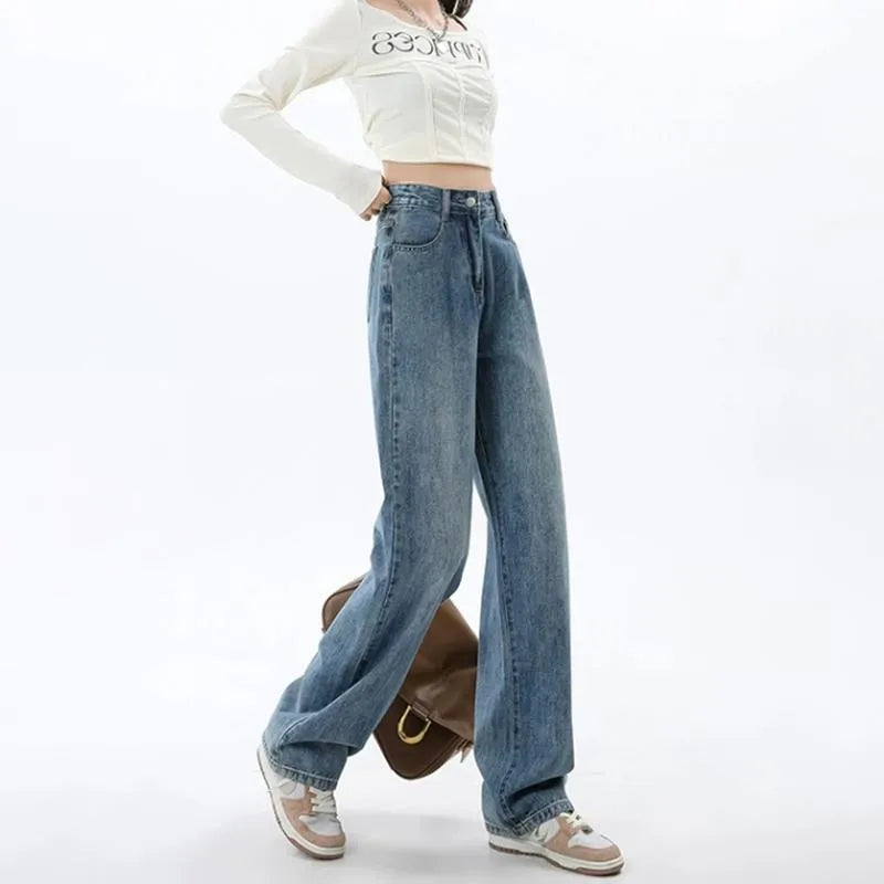 Woman wearing high-waisted retro blue wide-leg denim jeans with a straight cut.