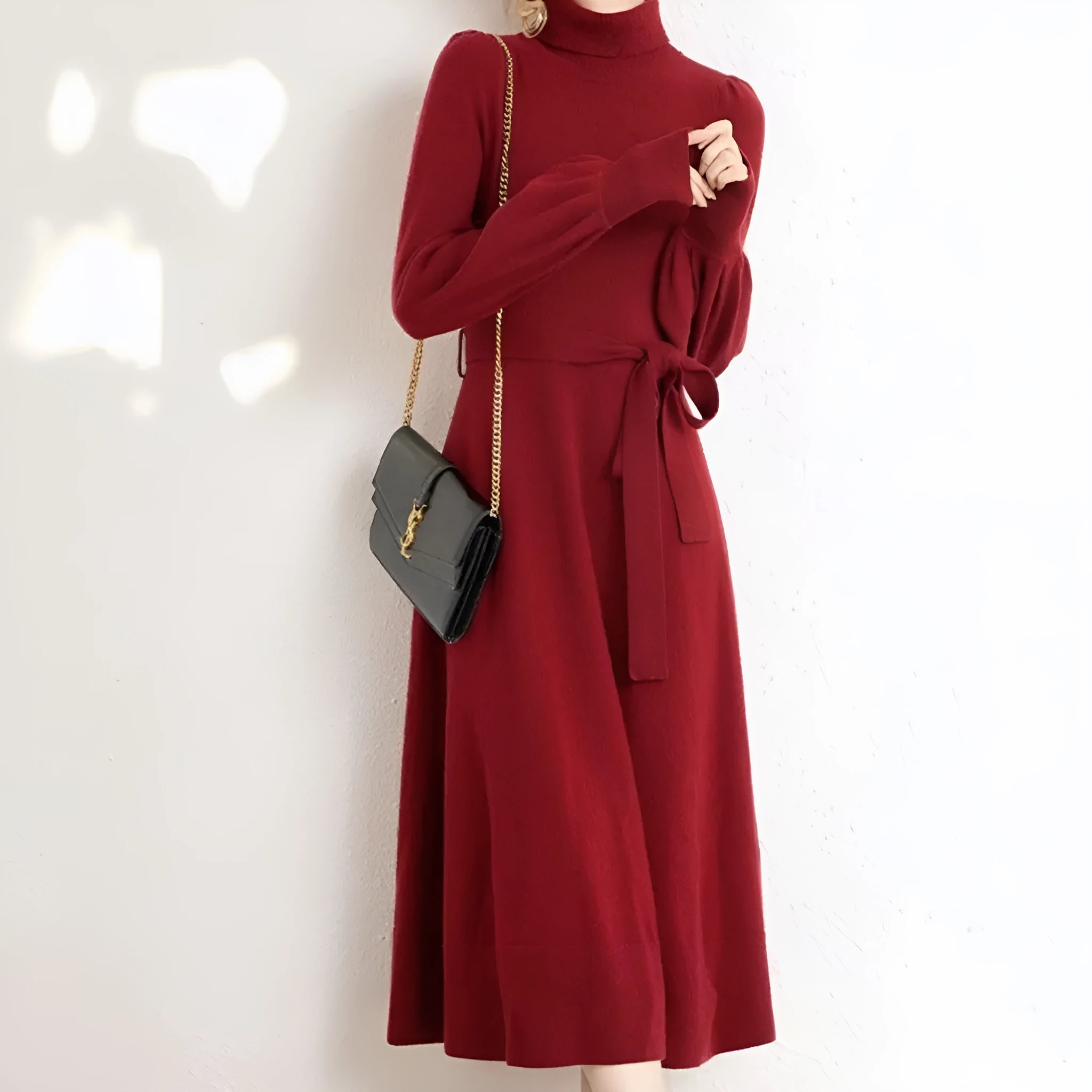 Rose red turtleneck knit dress with long sleeves, elastic waist, and a loose, flowing mid-length skirt.