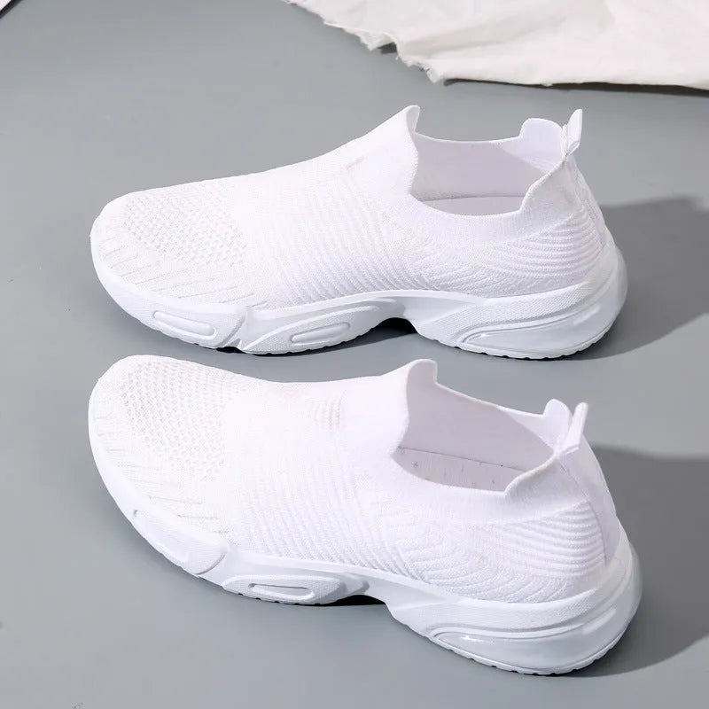 Breathable mesh slip-on lazy sock shoes in black, pink, khaki, and white colours on a PVC sole.
