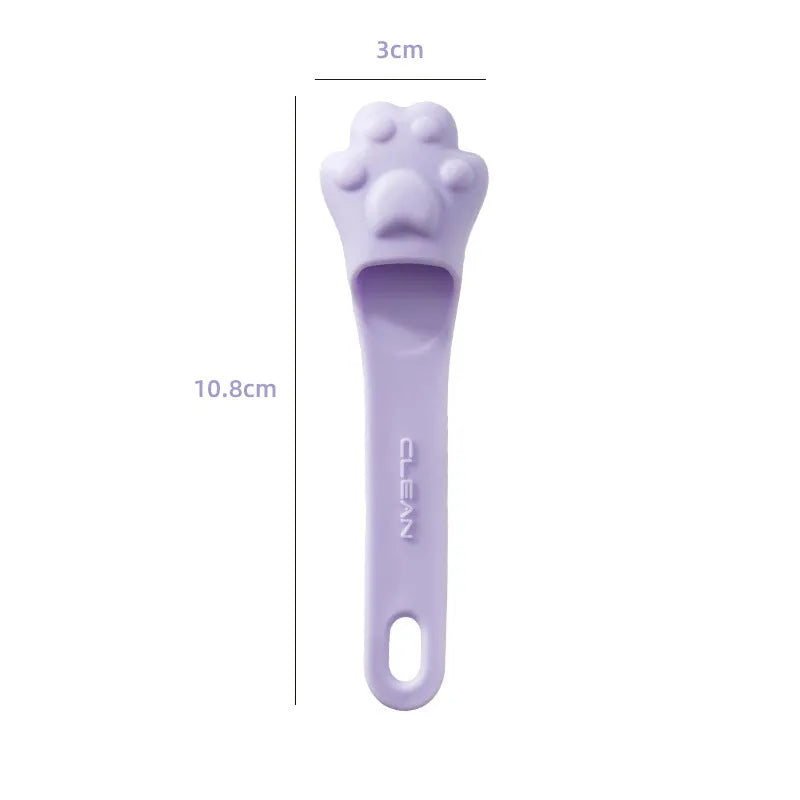 Silicone finger toothbrush for pets in pink, purple, and yellow colours