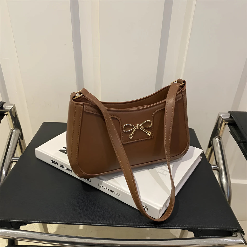 Western-style shoulder bag with bow decoration in multiple colours showing 24x14x5cm dimensions