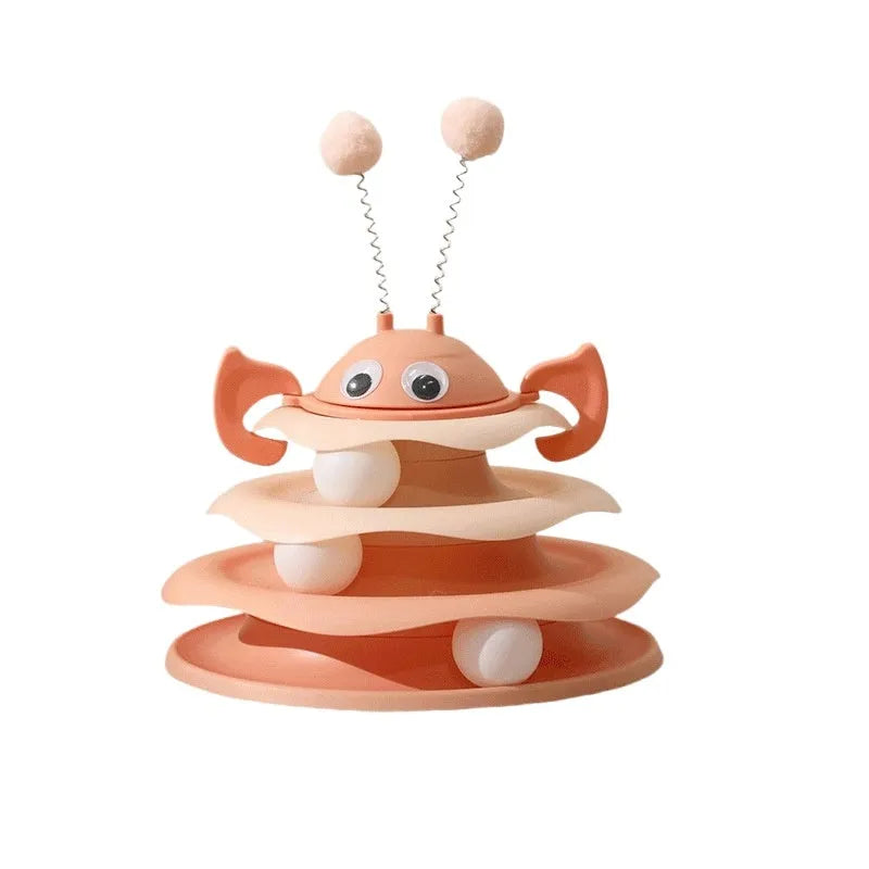 Cat toy tower with rotating bee toy and three-layer trackball in green plastic, placed on a wooden floor