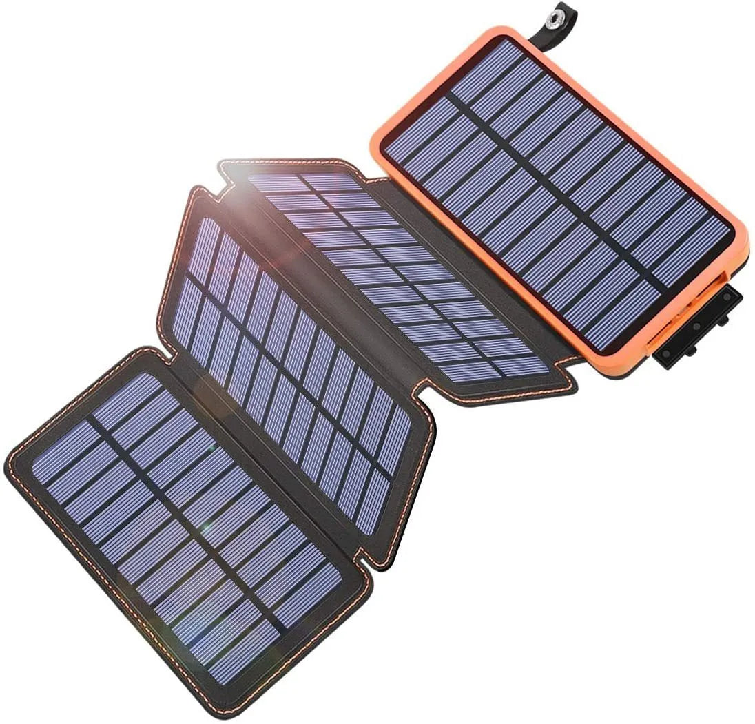 Outdoor solar power bank in orange with a solar panel, LED light, and leather texture, shown next to a charging cable.