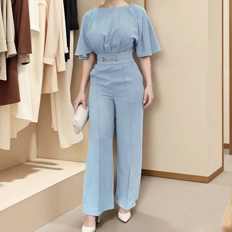 Blue men's polyester suit set with long-sleeved jacket and trousers on a hanger.