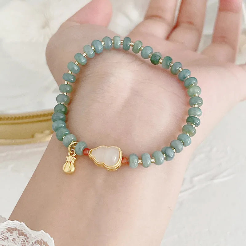 Women's simple ethnic style jade bracelet with Hetian jade gourd bead, peace buckle charm, and fu character pendant