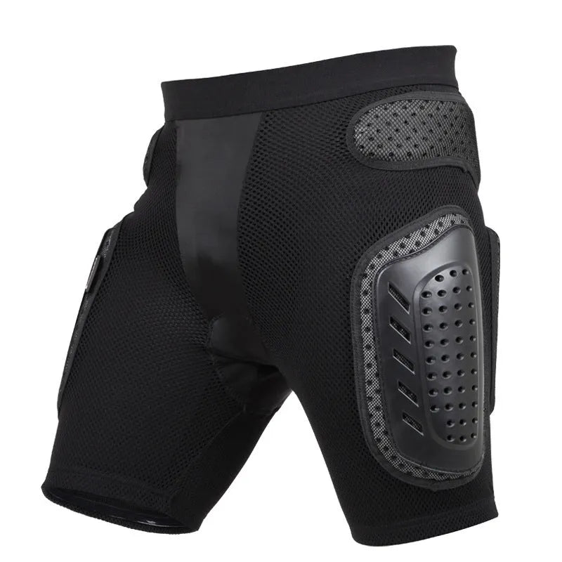 Black cycling hip protection pants with integrated pads, showing hook and loop fastener closures.