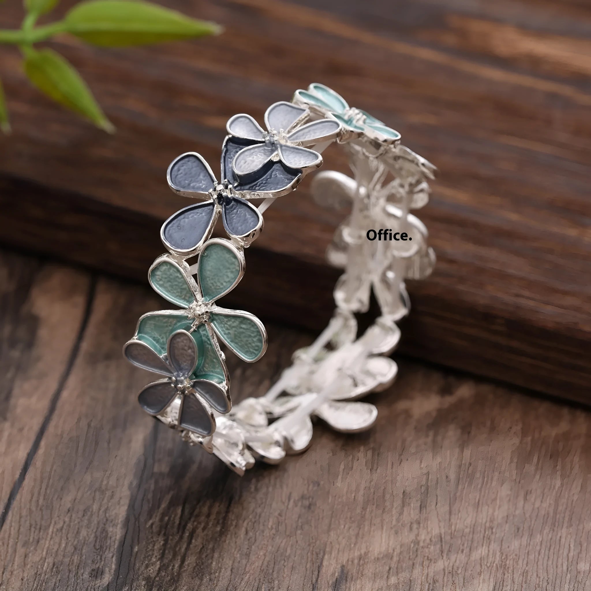 Zinc alloy flower elastic bracelet for women with dripping oil finish in blue, black, or colourful design.