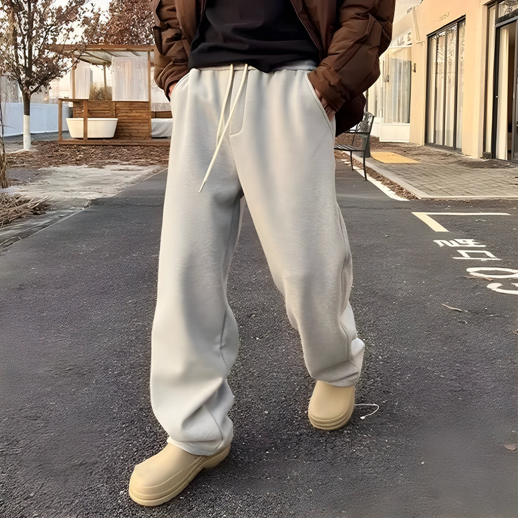 Men's casual sweatpants in black cotton loose fit with elastic waist and mid rise side view