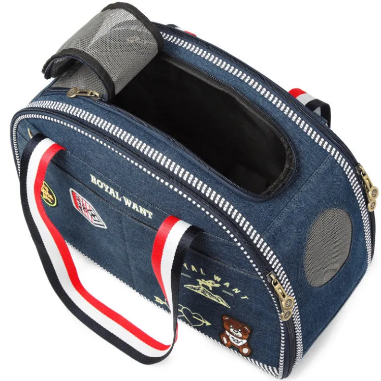 Blue denim pet diaper bag with cartoon pattern, dimensions 43cm by 20cm by 30cm.