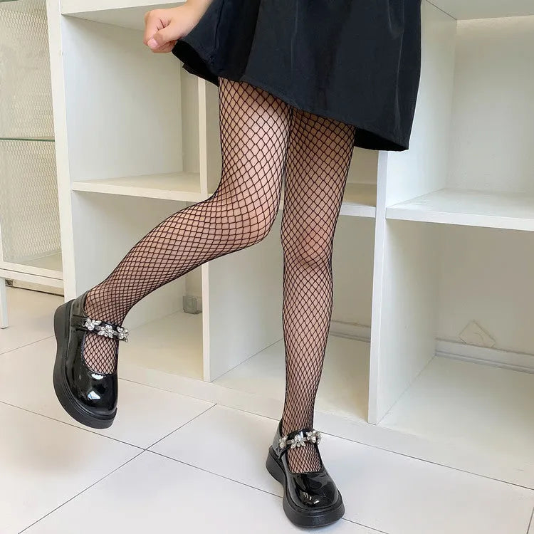 Women's black and white mesh stockings showing large, medium, and small net patterns in thin velvet polyester fabric.