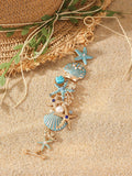 Alloy rhinestone bracelet with boat anchor, shell, and starfish charms in turquoise, red, or blue.