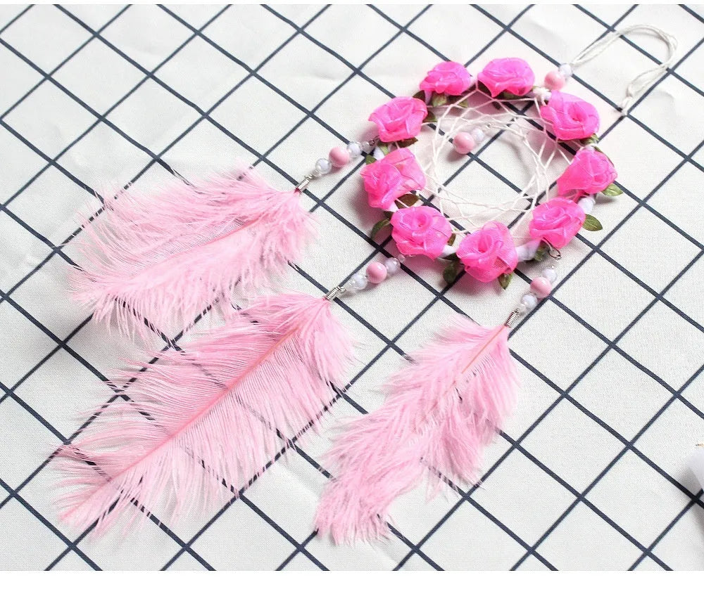 Pink ostrich feather dreamcatcher wind chime ornament measuring 10cm for wall decoration