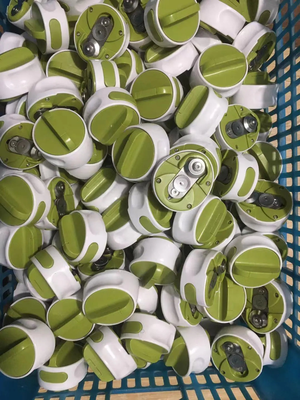 Green stainless steel bottle opener kitchen tool on countertop