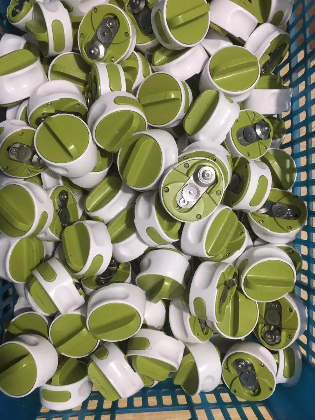 Green stainless steel bottle opener kitchen tool on countertop