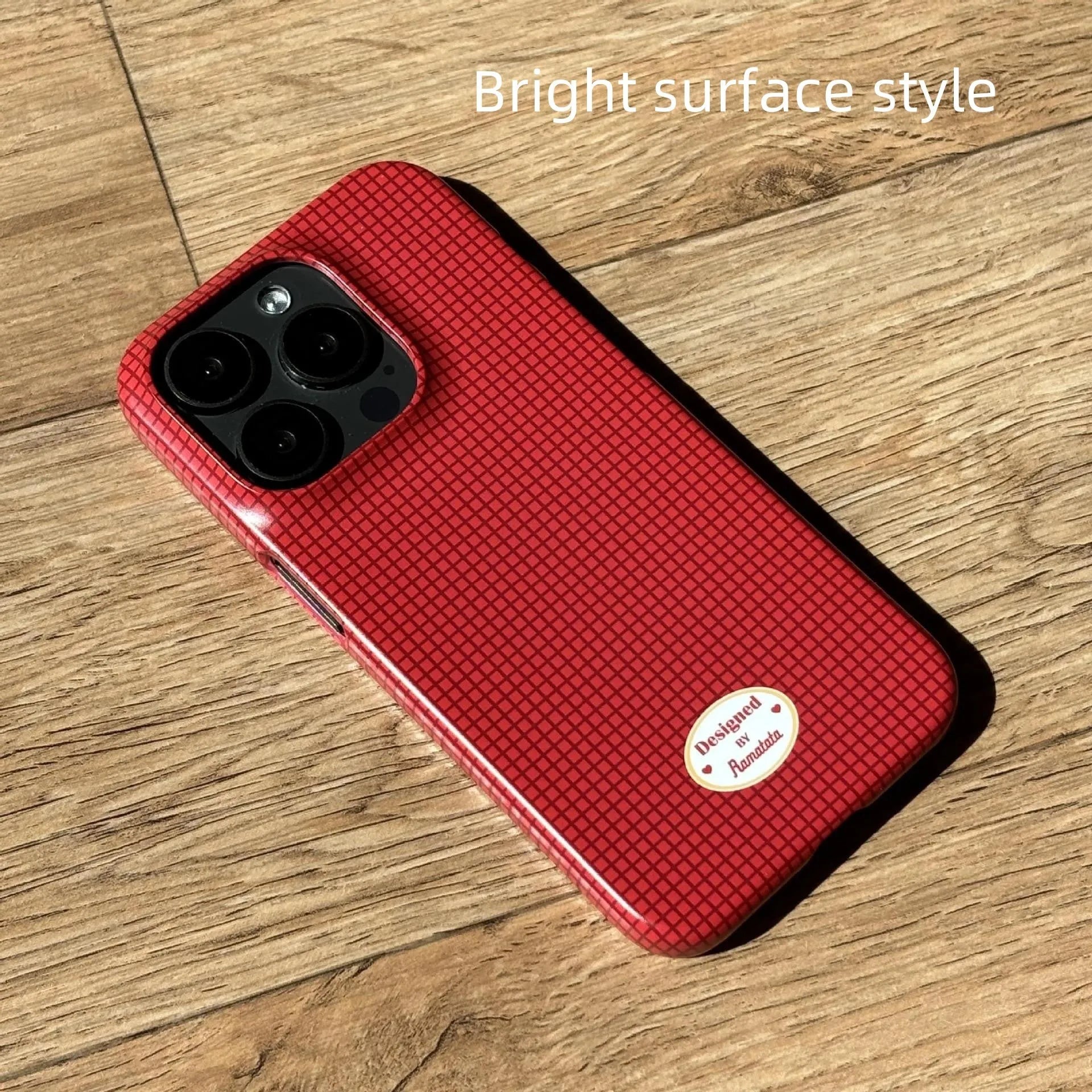Red and orange plaid iPhone 15 Pro Max phone case with glossy and frosted finish options.