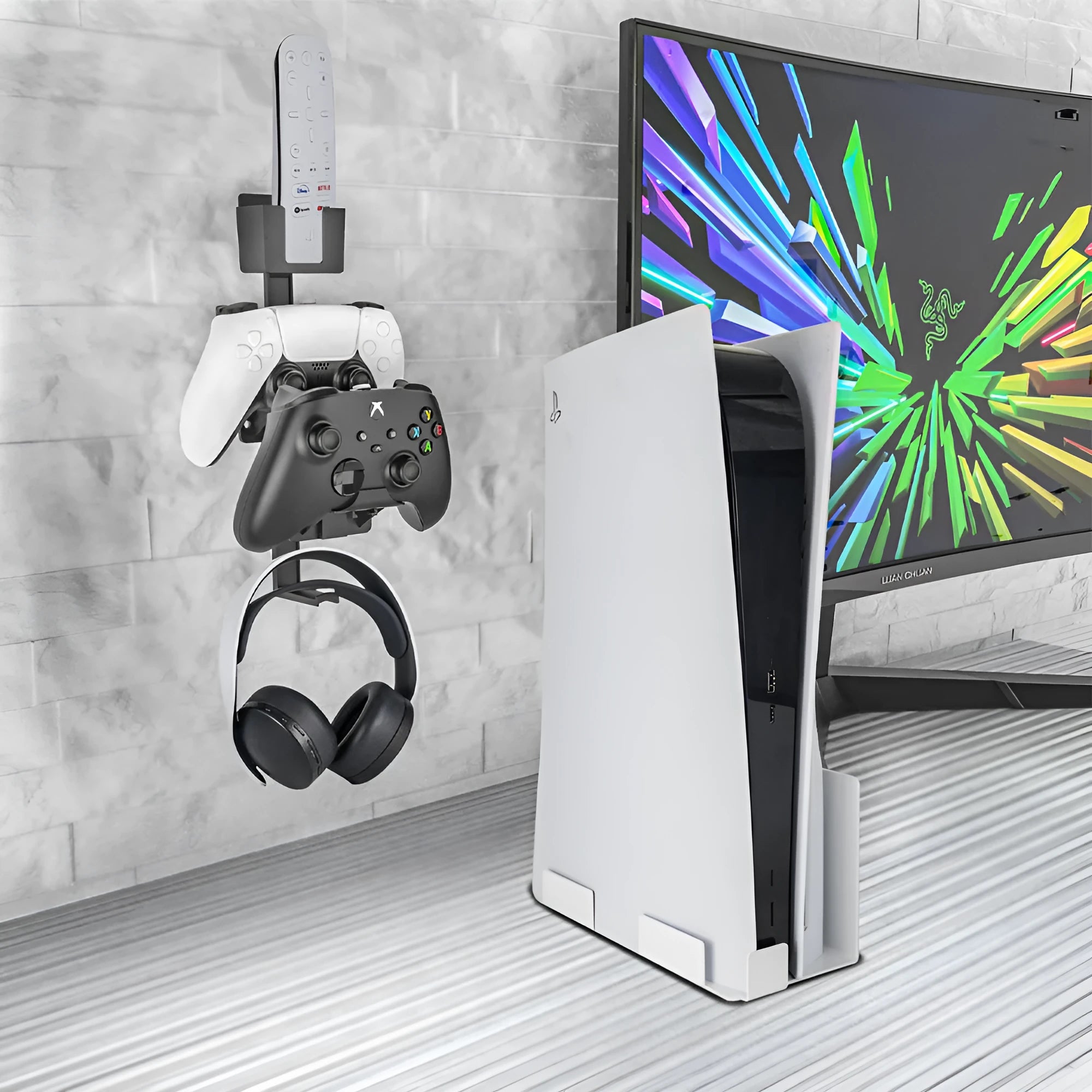 White ABS plastic wall hook holding a PlayStation controller and gaming headset.