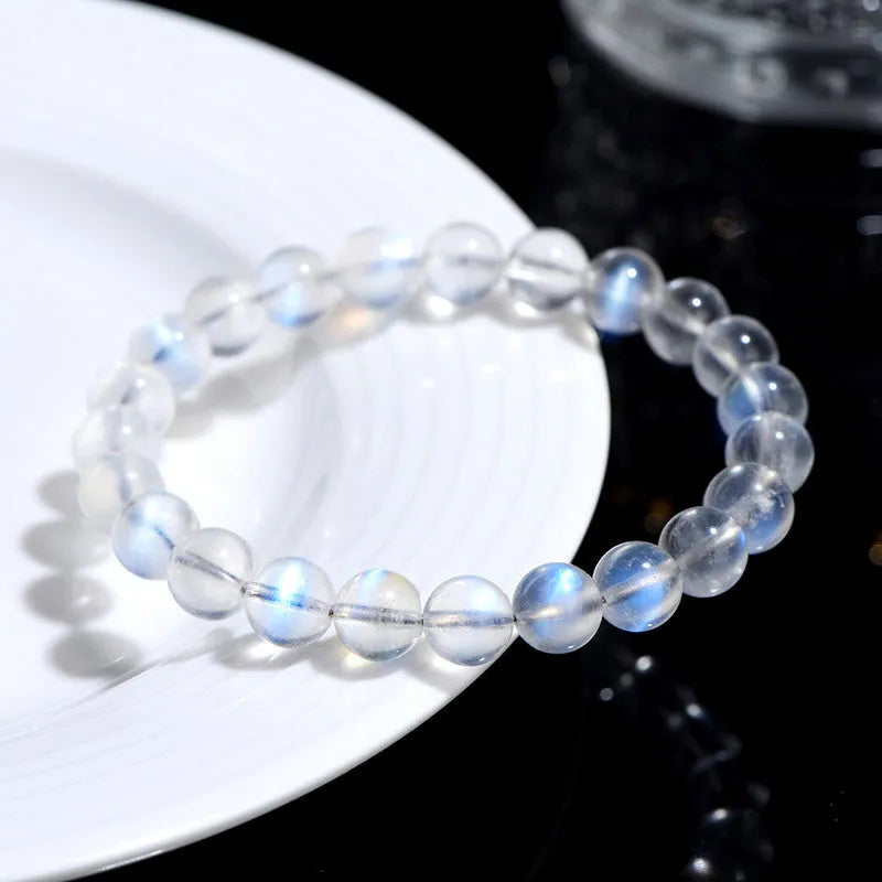 Natural cream body blue moonlight crystal bracelet showing minimalist design on wrist.