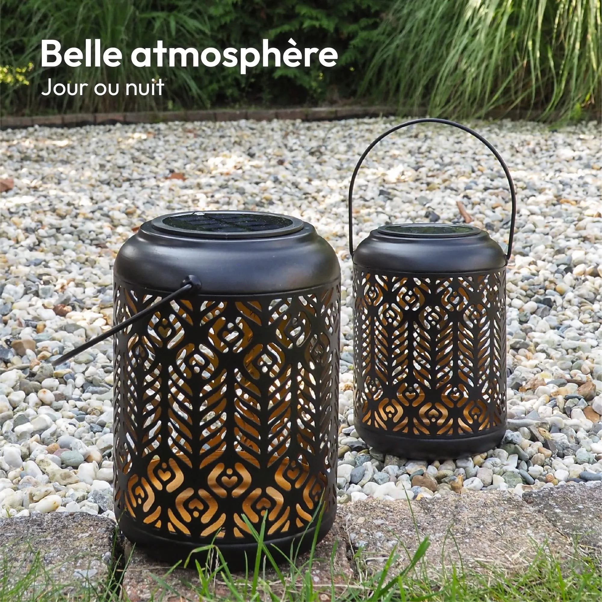 Black iron circular solar lamp with small cylindrical wheat ear design on a garden path