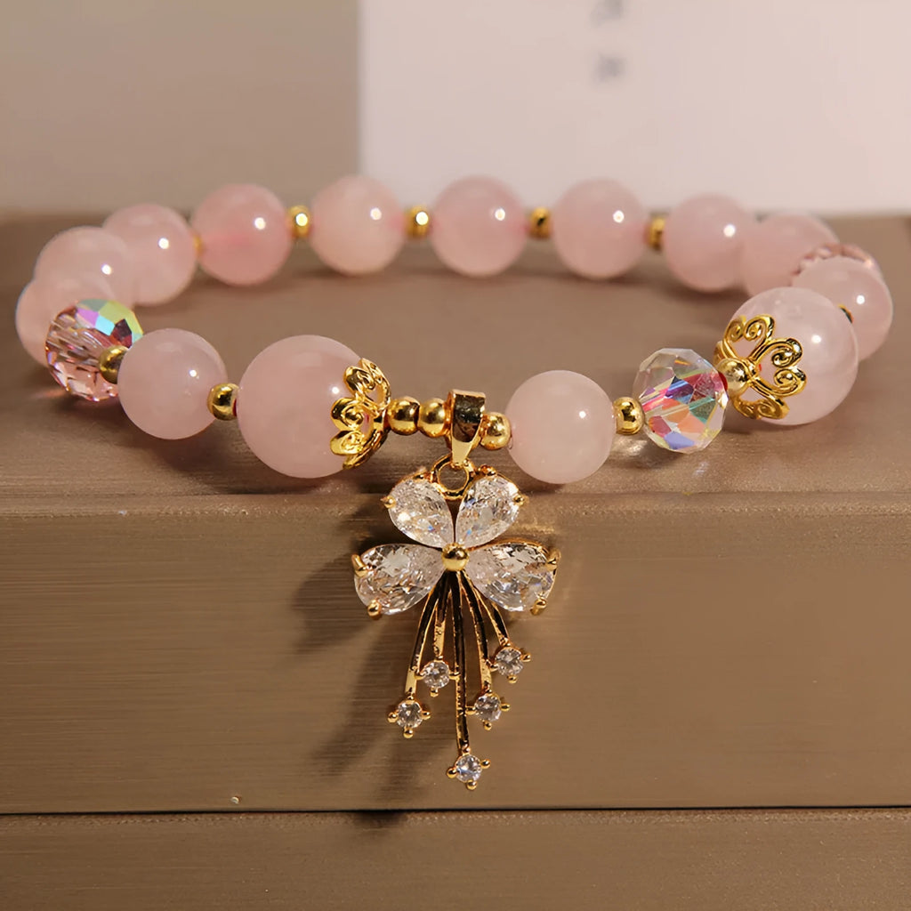 Normcore style crystal bracelet with amethyst and pearl charms on adjustable closure