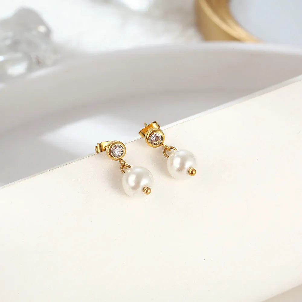 Women's C-shaped titanium steel earrings with pearl inlay flower design in gold