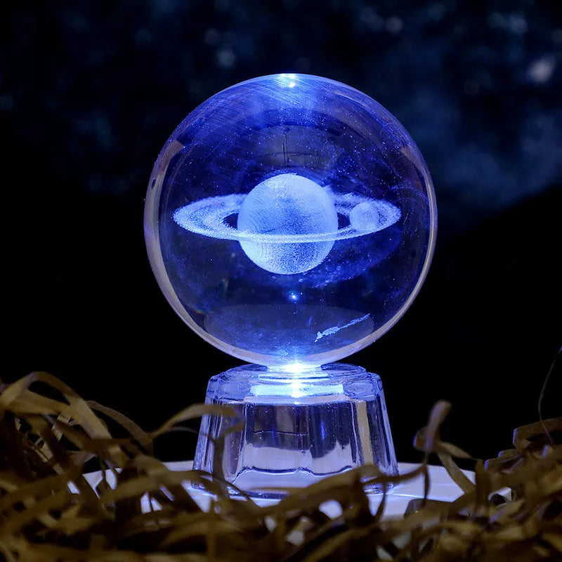 Transparent 6cm crystal ball ornament with inner carving on a fixed base, modern minimalist decor.