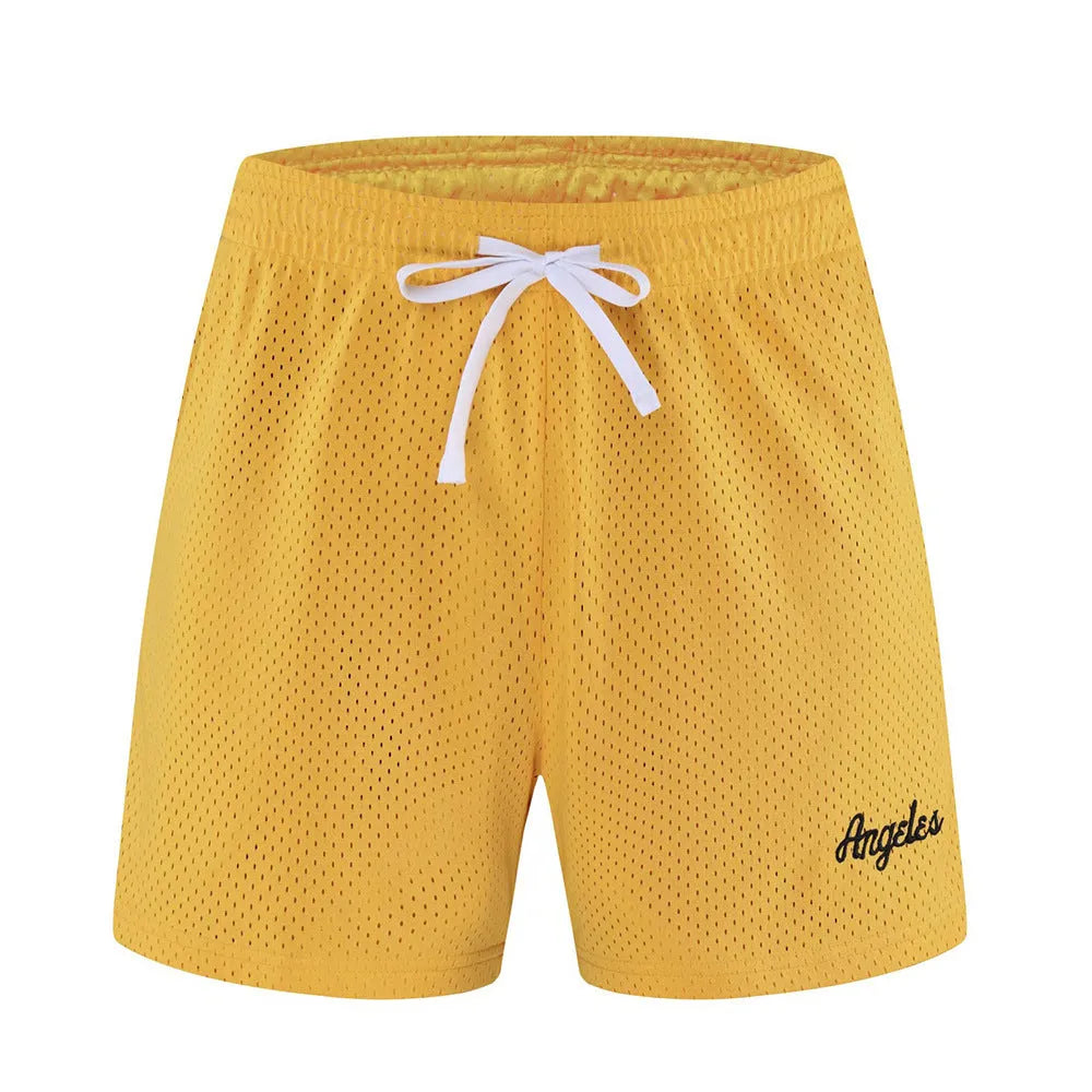 Men's black double-layer mesh sport shorts on a white background.