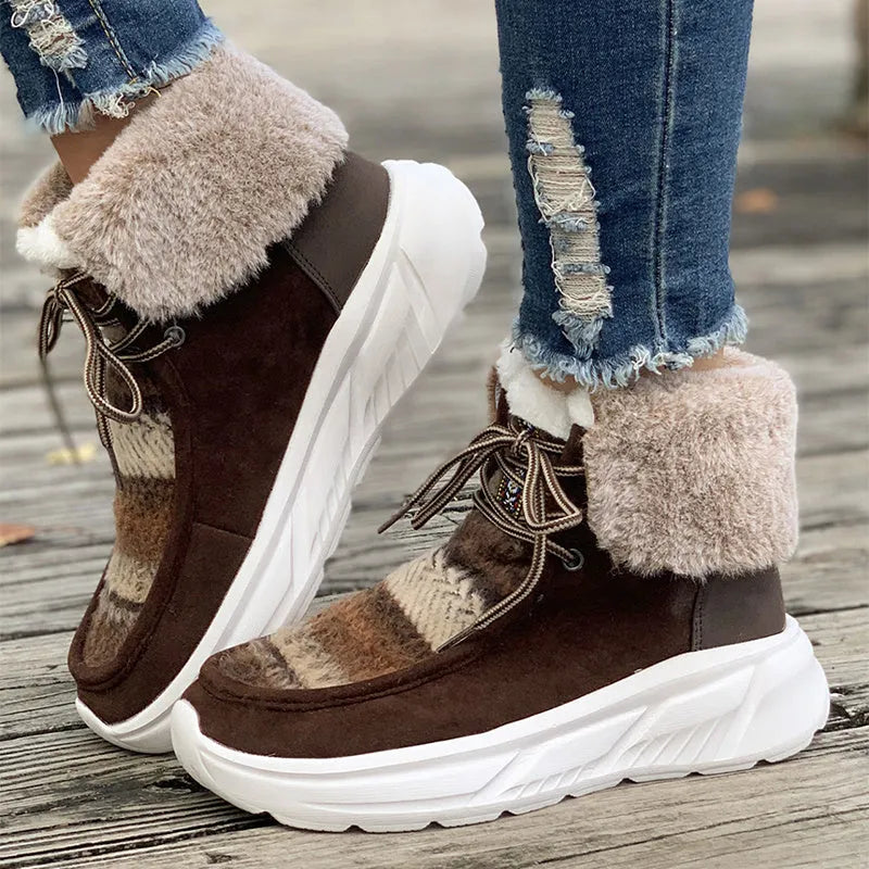 Women's beige lace-up suede snow boots with fuzzy lining and a thick non-slip rubber sole.