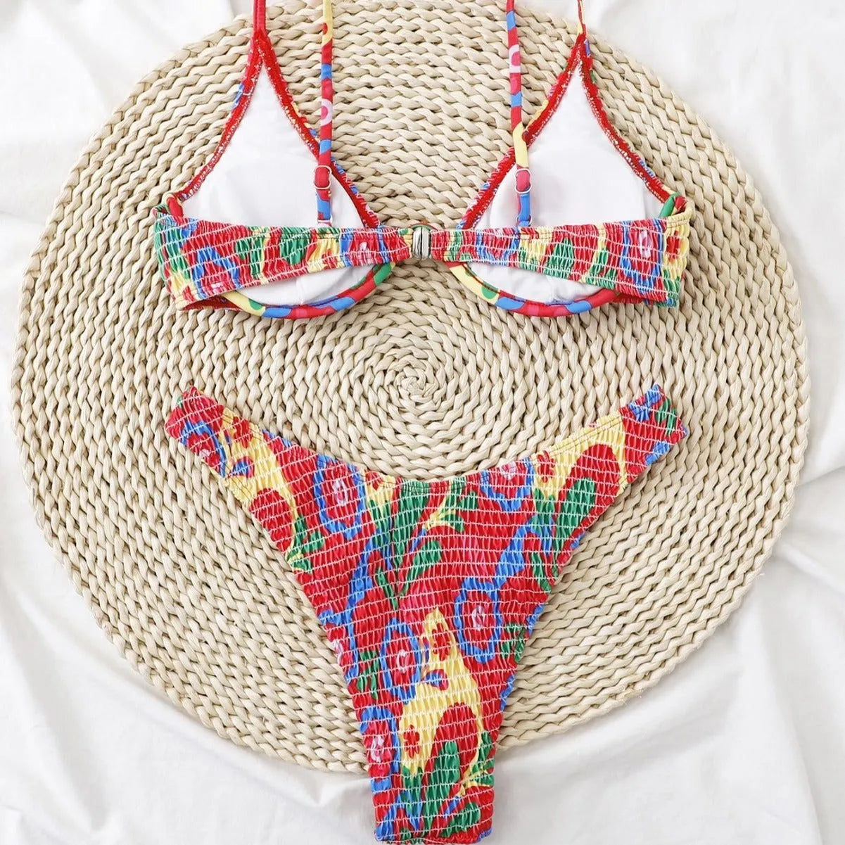 Red floral print women's underwire two-piece bikini swimsuit on a mannequin.