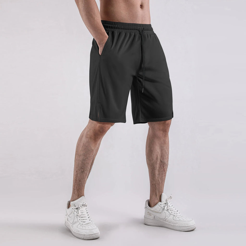 Man wearing black quick-drying mesh fitness shorts with elastic waistband