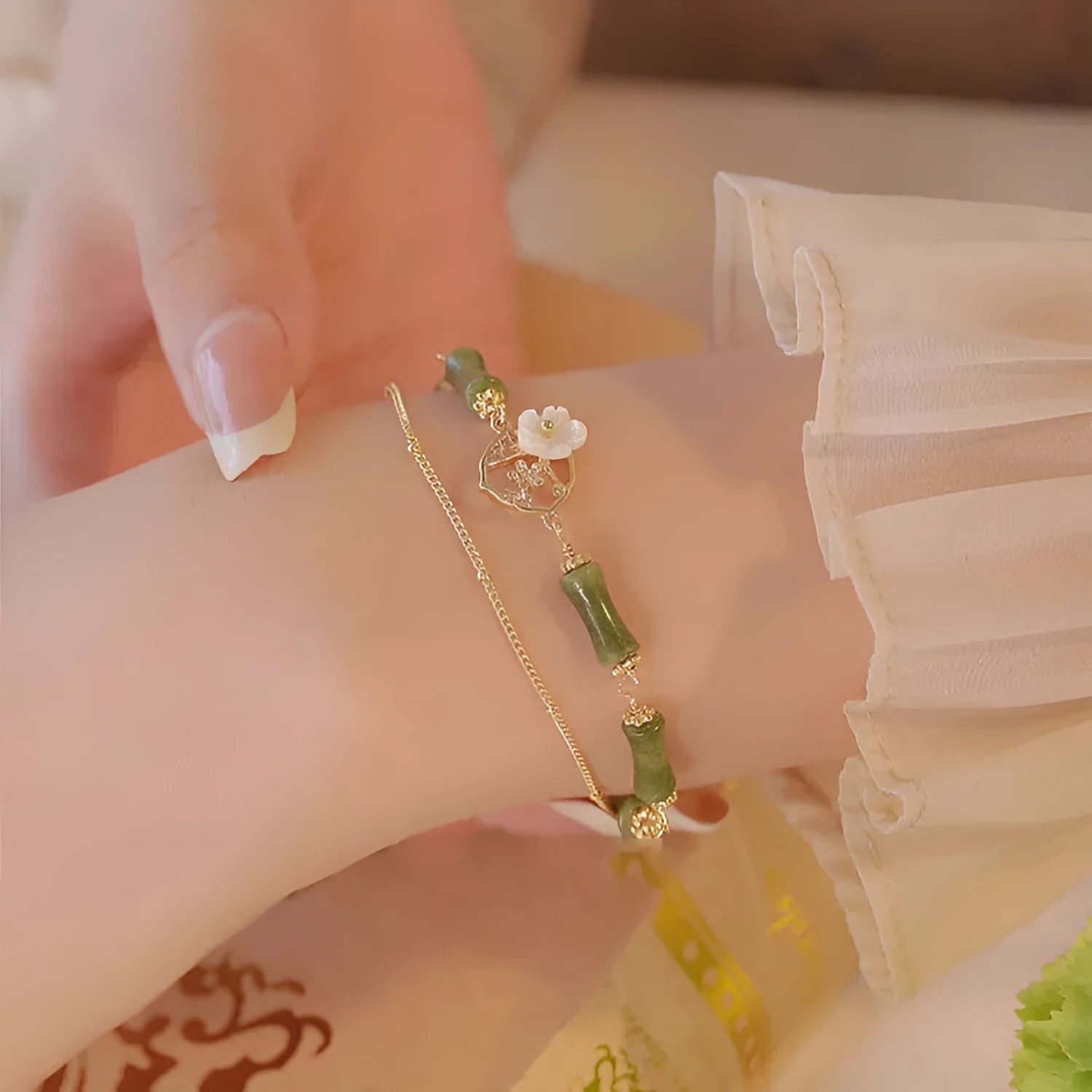 Natural olivine double layer bracelet with twin bells of Ireland charms and olive branch elements