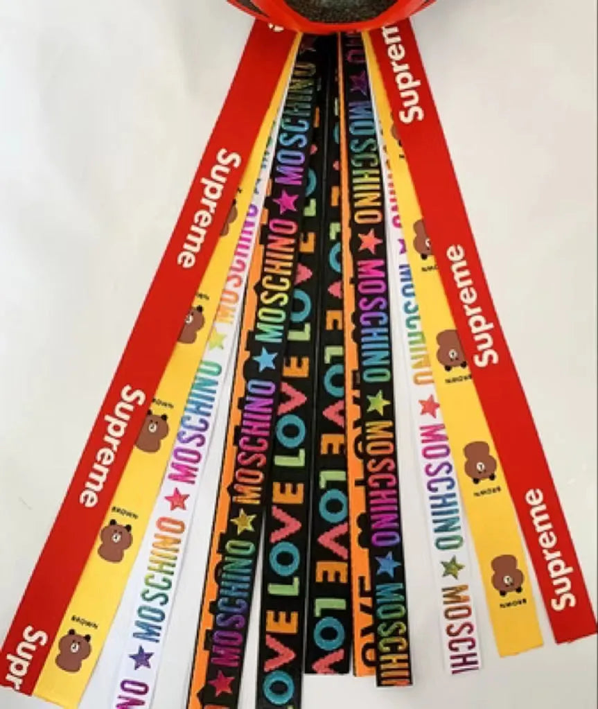 A decorative ribbon streamer for attaching to a child's roller skate or ski helmet, shown in a selection of colours.