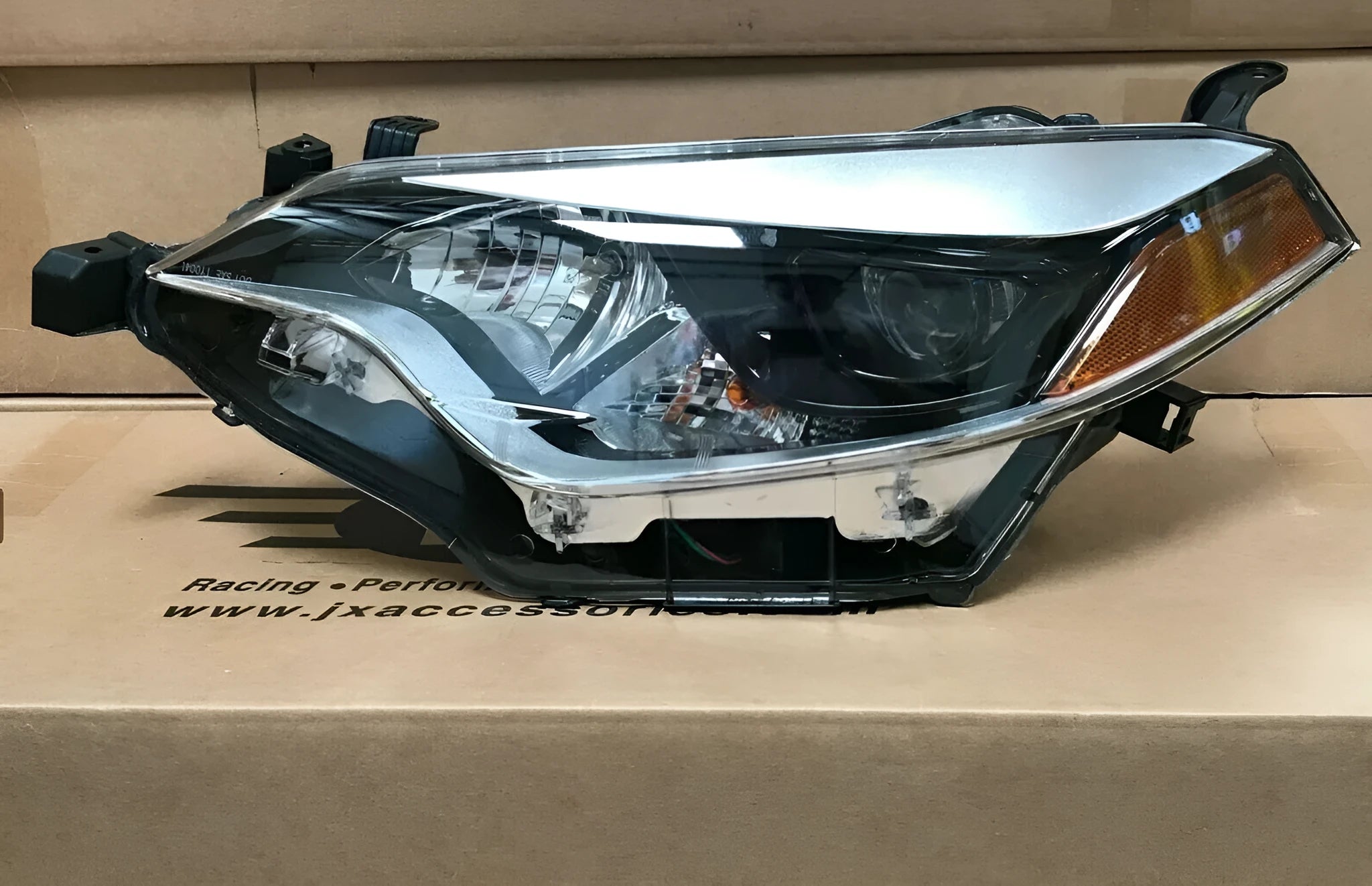 Halogen headlight assembly for a 2014-2015 Toyota Corolla, driver side.