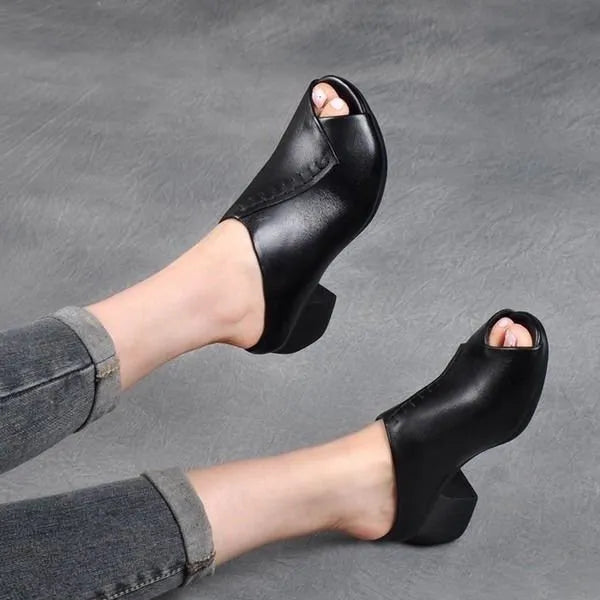 Women's black square heel peep-toe slippers with a fish-mouth scaffold design on a white background.