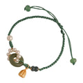 Hand-woven flexible wire watch bracelet with a pearl peace buckle in retro style for women.
