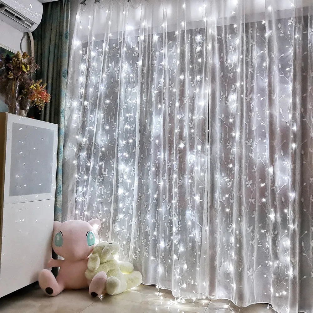 Sound control curtain light string in warm white mode hung on a wall, USB cable visible
