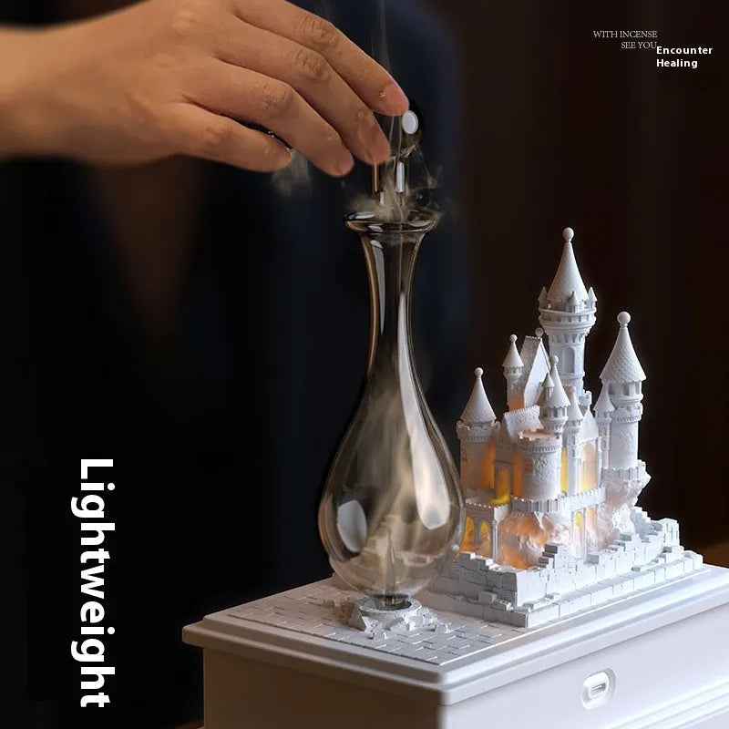 White medieval castle design waterless aromatherapy machine with ambient light on a wooden surface.