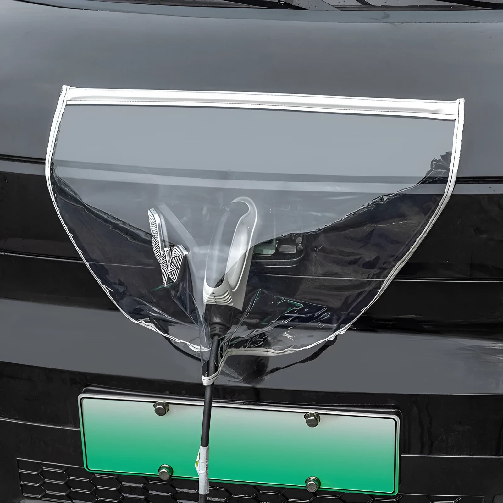 Black electric vehicle charging rain cover with magnetic strips, unfolded to 60cm by 50cm dimensions