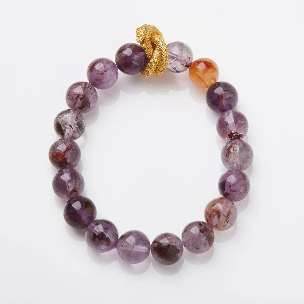 Purple cornucopia crystal bracelet with 10mm animal zodiac beads on wrist