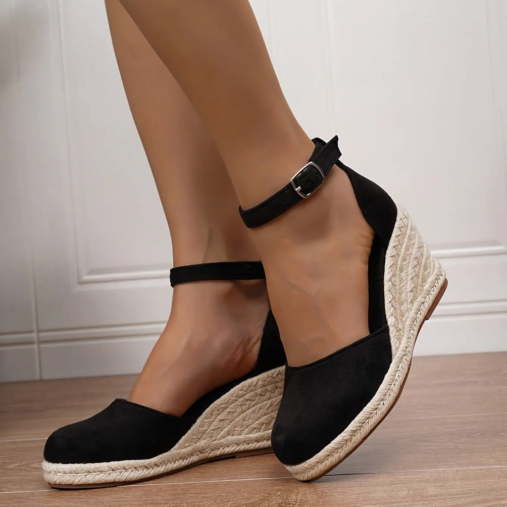 Women's apricot suede wedge sandals with an adjustable ankle buckle and rubber sole.