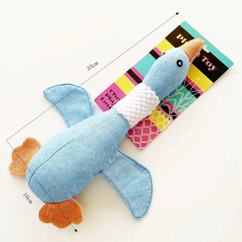 Blue, green, or grey duck-shaped plush dog toy with two squeakers.