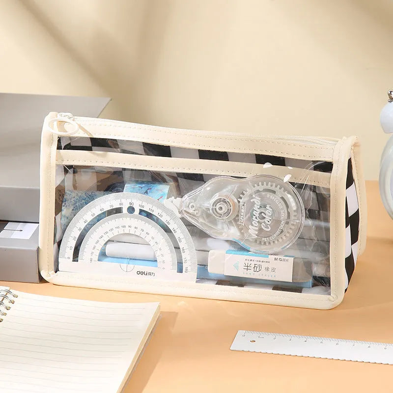 Transparent PVC pencil case with chessboard grid pattern, showing pens inside.