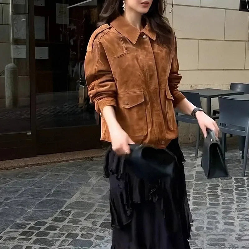 Bright brown suede-effect women's coat with regular sleeves on a hanger