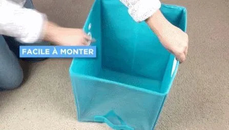 Blue folding storage basket with clear front panel on a wooden shelf, shown next to its folded flat state.