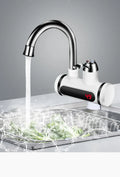 White kitchen electric instant water heater tap with digital temperature display on its front.