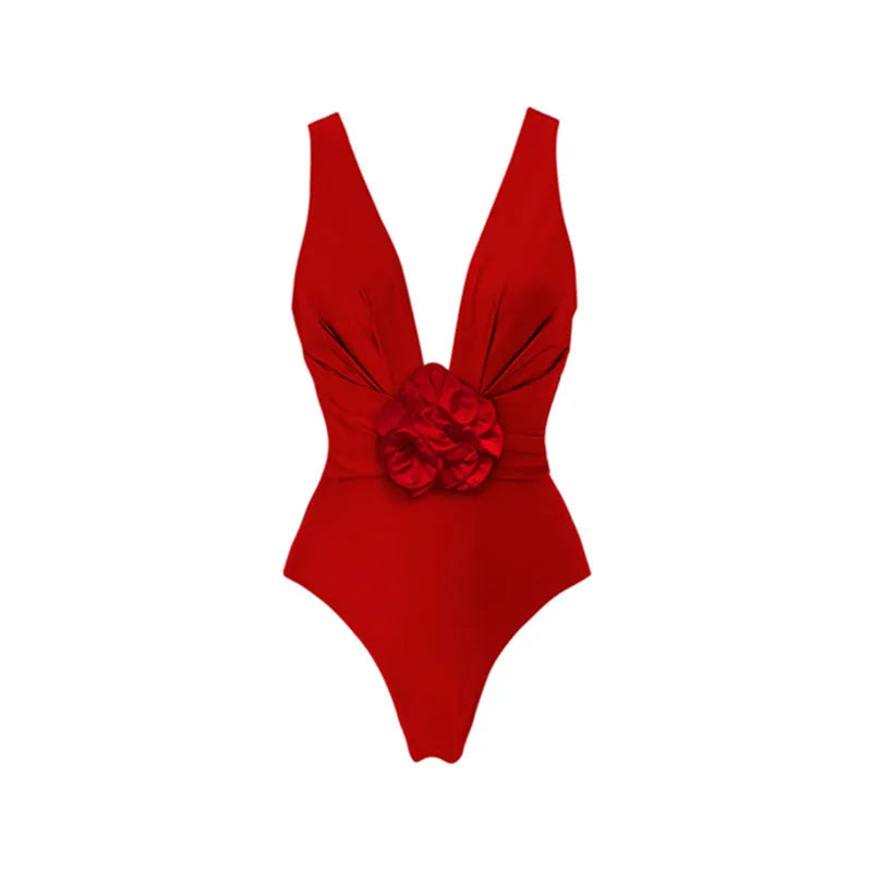 Red V-neck one-piece swimsuit with open back and a detachable long skirt laid flat.