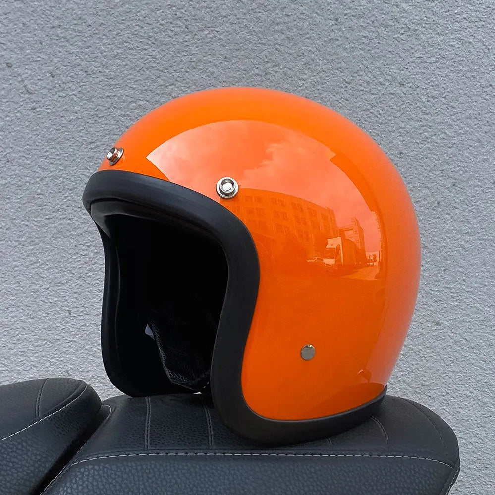 Retro-style open-face motorcycle half helmet in cement grey with a glossy FRP shell and quick-release chin strap.