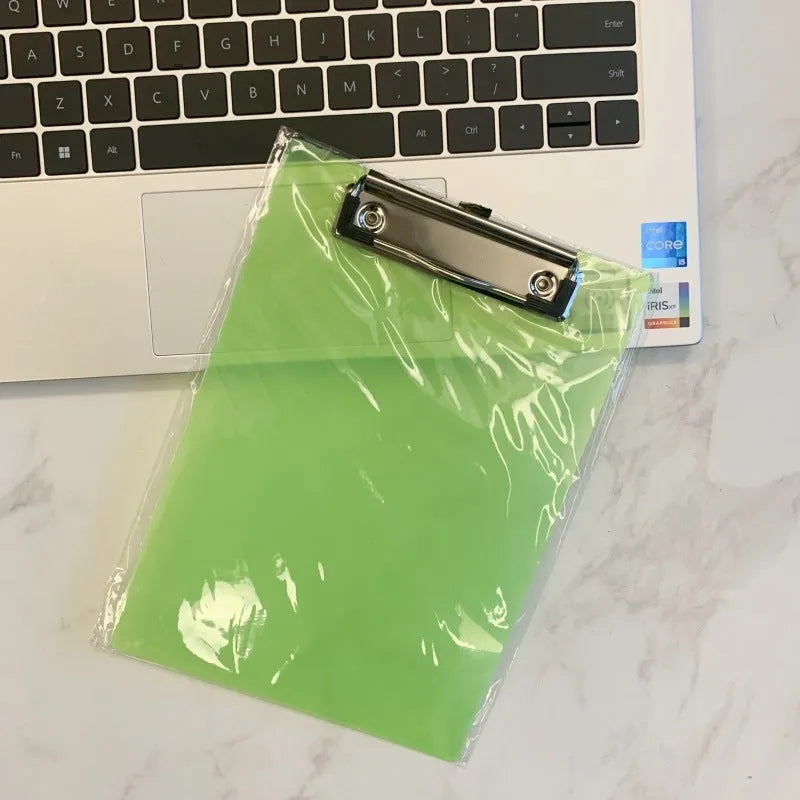 Transparent A4 writing board pad with metal clip holding paper, shown in blue colour option